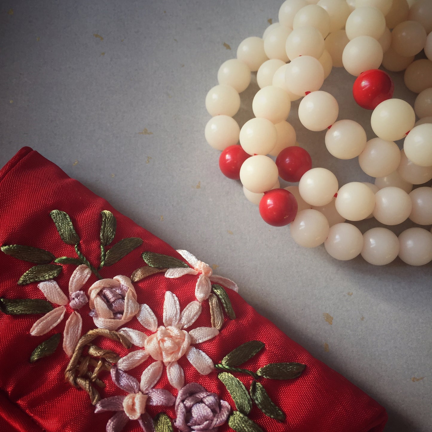 Creamy White Bodhi Seed Mala Bracelet with Red Cinnabar Bead.