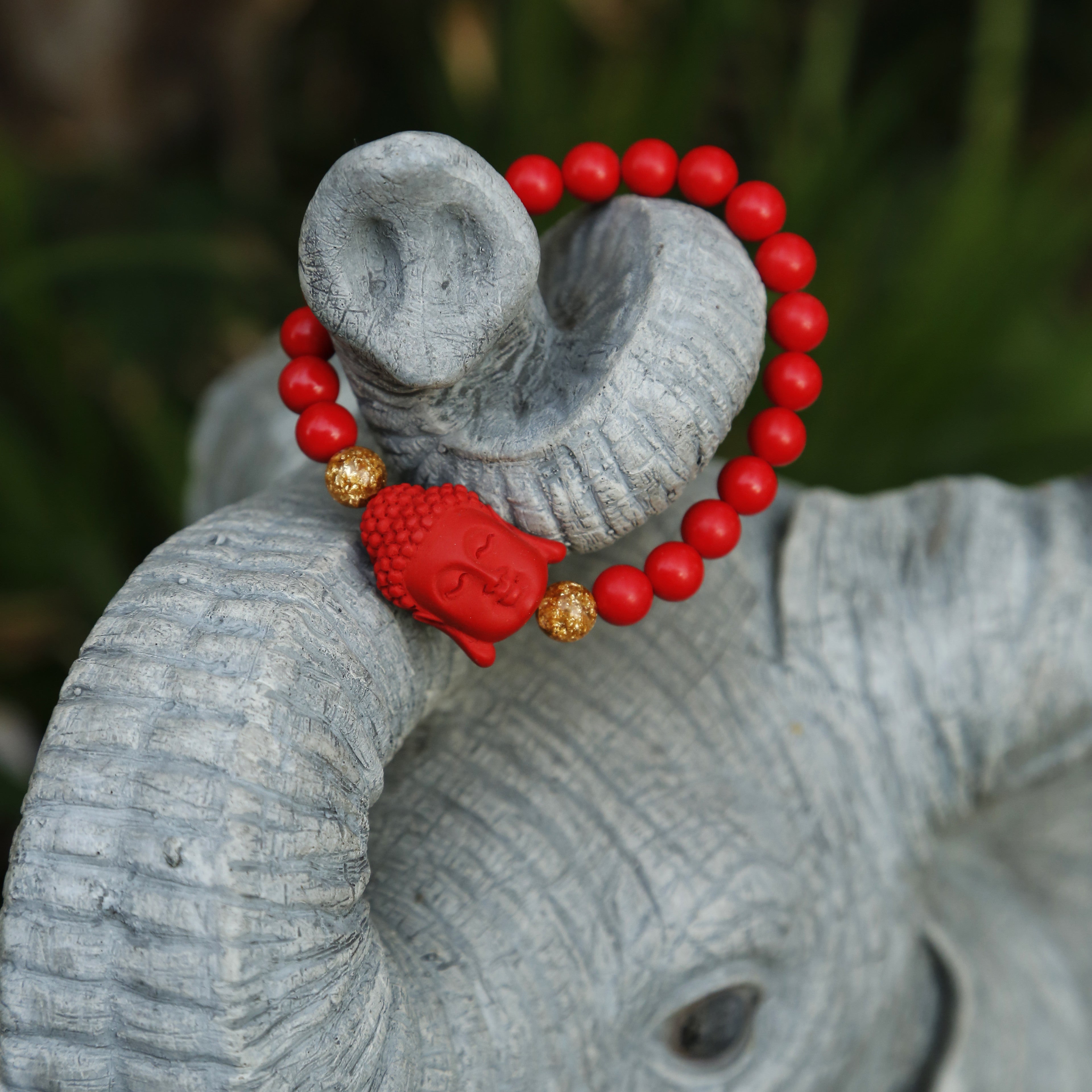 Red bracelet with sale elephant meaning